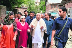 People's Democratic Party patron and former Chief Minister Mufti Mohammad Sayeed during a road show in south Kashmir Anantnag district on Wednesday
