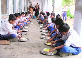 Students being served mid-day meal in government school in Ludhiana