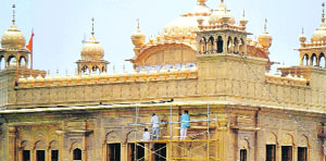 The gold plates being cleaned up at the Golden Temple on Wednesday. 