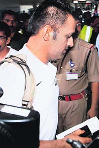 Captain MS Dhoni at Mumbai airport on Wednesday before the teams departure for England to participate in the Champions Trophy