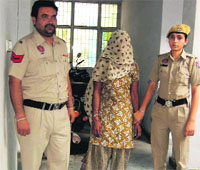 The woman accused of inflicting burn injuries on a child in police custody on Thursday. A Tribune photograph