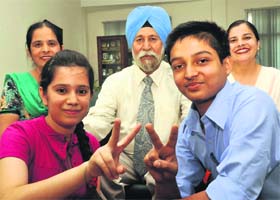(Left) Saranjot Kaur and Shashikant, who scored 10 CGPA in the CBSE Class X examinations in Mohali on Thursday