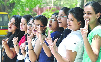 Students celebrate their success after the announcement of CBSE Class X results, at their school in New Delhi on Thursday.
