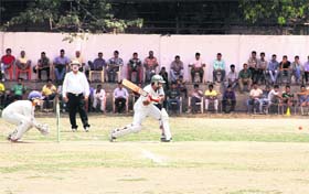 Players in action in a match during the 31st All-India Uttarakhand Gold Cup Cricket Tournament in Dehradun on Thursday