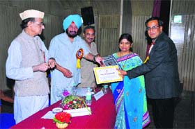 Dr Surender Gupta, Associate Professor and head of the MBA department, Maharaja Agrasen Institute of Management and Technology, Jagadhri, receives the  awards during a function at the Indian Society of International Law, New Delhi
