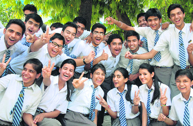 Students of Apeejay School, who secured 10 CGPA in Class X CBSE exams, cheer after the declarartion of the results in Jalandhar on Thursday.