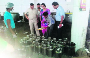 A team of the health department collects samples of mid-day meal at Sherpur Kalan.