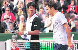 Somdev Devvarman and Roger Federer after their second round match on Wednesday. 