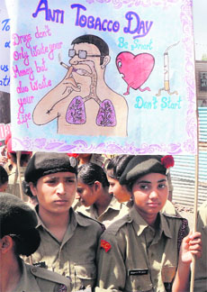 NCC cadets hold placards urging people not to consume tobacco, on No-Tobacco Day in Amritsar on Friday.