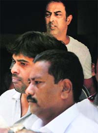 Chennai Super Kings' owner Gurunath Meiyappan (centre) and actor Vindoo Dara Singh (top) being produced in a court in Mumbai on Friday