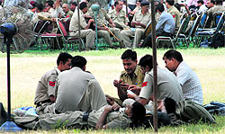 Haryana policemen refresh themselves by playing cards and taking a nap in Panchkula on Saturday