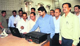 Deputy Commissioner Ashish Singhmar launches the direct benefit transfer scheme in Hamirpur on Saturday
