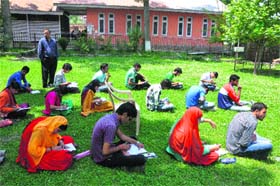 Students take an examination in the lawn of Government Degree College, Bhaderwah, as the building had developed cracks due to the earthquake