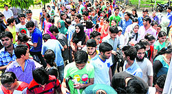 Students come out after taking the AIIMS entrance exams at Government Womens College in Jammu on Saturday