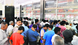 Peoples rush outside the ticket windows at the Ludhiana railway station. Photo: Inderjeet Verma