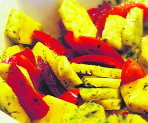 Tomatoes and chunks of pineapple add punch to pineapple salad