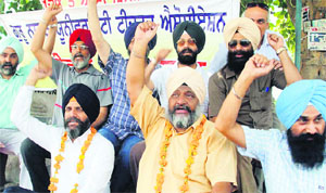 Teachers of the Guru Nanak Dev University stage a protest in Amritsar. 