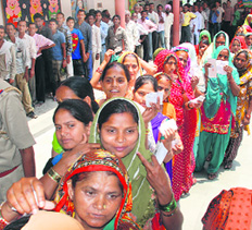 Voters stand in queues to cast their ballot during the municipal corporation elections in Sector 16, Panchkula.