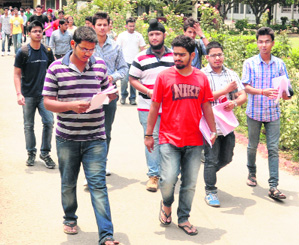 dents come out of an examination centre in Sector 36, Chandigarh, on Sunday.