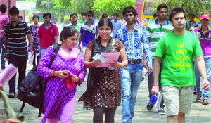 Students come out of the centre after appearing for the JEE (Advanced) Examination-2013 at Modern School in New Delhi on Sunday. 