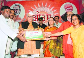 The Uttarakhand Governor, Dr Aziz Qureshi, being presented a souvenir at the opening ceremony of a gurukul at Paundha, near Dehradun, on Sunday