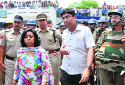 Deputy Commissioner Renu S Phulia (second from left) and Superintendent of Police Shashank Anand (third from left) at Phusgarh village in Karnal where a supporter of one of the candidates was allegedly killed by opponents on Sunday. Tribune photo: Ravi Kumar