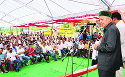 Chief Minister Virbhadra Singh addresses a public meeting at Shamshi in Kullu on Sunday. Photo by writer