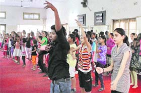 Students participate in a dance class during a 15-day summer camp in Jalandhar
