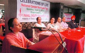 A participant addresses a seminar on the National Cancer Survivors Day in Jalandhar on Sunday