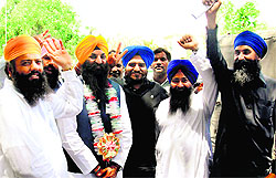 Ramesh Singh Arora (2ndL), first Pakistani Sikh being greeted after he took oath as a member of the Punjab Provincial Assembly in Lahore on Saturday