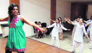 US-based choreographer Joti Singh teaches freestyle dance and bhangra to children in Amritsar on Monday. 