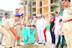DIG Suraj Bhan Kajals wife Sunita Kajal plants a sapling on the premises of Sonepat Group Kendra of the CRPF near Khewra village in Sonepat. Photo by writer