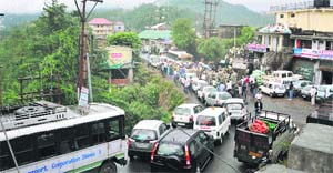 Residents of Jutog area block traffic near Totu in Shimla on Monday. 