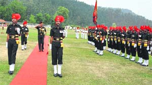 Lieut-Gen Sanjeev Madhok, VSM, General Officer Commanding-in-Chief, Army Training Command, reviews a guard of honour at the Annandale ground in Shimla on Monday