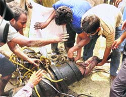 Efforts on to rescue a boy from the Gokaran pond in Rohtak on Monday. The victim could not be saved. 