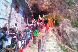 Devotees queue up outside the Shiv Khori shrine