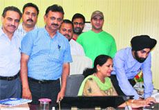 Prof Neelam Saraf, Dean Academic Affairs, University of Jammu, launches online admit card facility for Jammu University Entrance Test in Jammu on Monday. A Tribune photograph