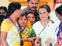 UPA chairperson Sonia Gandhi with rural women in New Delhi on Monday