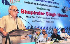 Haryana CM Bhupinder Singh Hooda addressing the 60th AGM of the Faridabad Industries Association in Surajkund on Monday