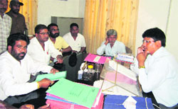 A section of the sanitary workers of the Dehradun Municipal Corporation meets Additional District Magistrate Harak Singh Rawat regarding the election of their union in Dehradun on Tuesday.