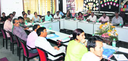Participants at a national workshop to review educational material for the Saakshar Bharat Programme in Dehradun on Tuesday. 