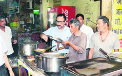A team of the health department conducts a surprise check at eating outlets at the bus stand in Jalandhar on Tuesday. Photo: Sarabjit Singh