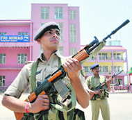 CRPF jawans stand guard at Yatri Niwas in Jammu on Tuesday. 