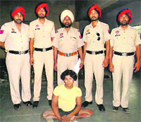 The accused, Goba, in police custody, in Ludhiana on Tuesday. a tribune photograph