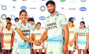Indian hockey womens captain Ritu Rani and mens captain Sardar Singh at a function organized by Hockey India for the unveiling of new team uniforms on Tuesday.