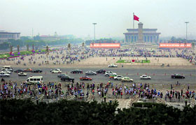 Visitors crowd Tiananmen Square and Tiananmen Gate in Beijing on Tuesday. Chinese authorities tightened security on Tiananmen Square on the 24th anniversary of the bloody military crackdown on pro-democracy protesters in Beijing.
