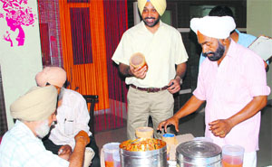 District Health Officer Dr Shivkaran Singh Kahlon and his team collect samples from a food joint at Ranjit Avenue in Amritsar on Wednesday.