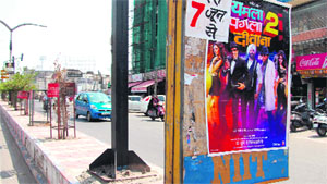 A film poster on a divider at the Lawrence road in Amritsar. 