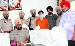 The Kotwali police with the seized capsules and the accused in Amritsar on Wednesday. 