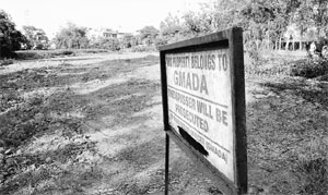 A board installed on a plot belonging to GMADA warning trespassers of prosecution in Mohali. 
